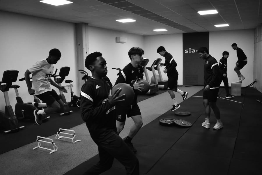 Football athletes training in the gym